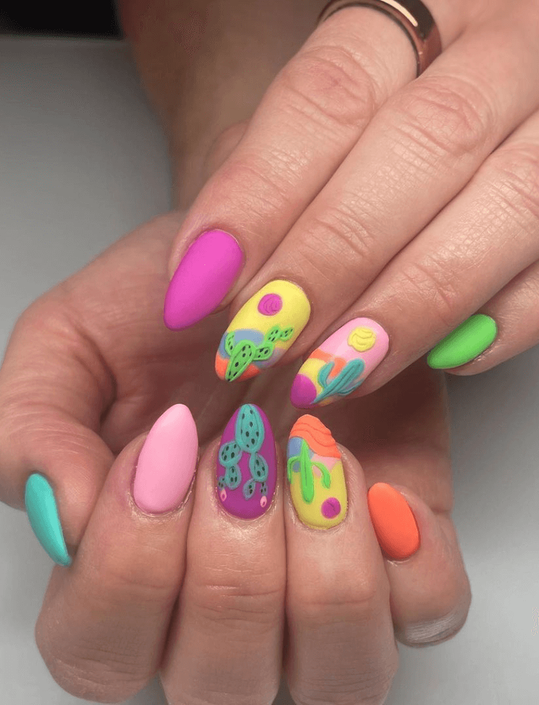 Festive Cinco de Mayo nails featuring an array of matte and glossy finishes with cactus designs and a blend of pink, green, turquoise, and orange hues, perfect for a celebratory occasion.
