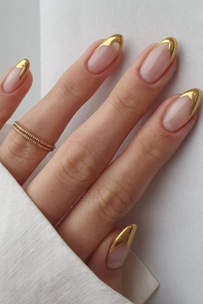 Bridal nails with gold dipped French tips.
