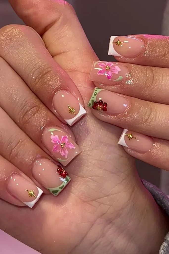 Hands showing summer nail designs featuring beautiful flowered watermelon nails