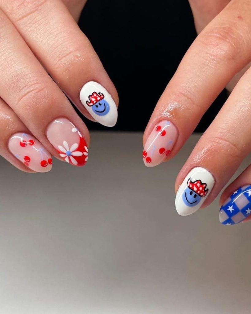 4th of July nails featuring blue smiley with red cowboy hat, blue white star checked and red, blue and white floral accent
